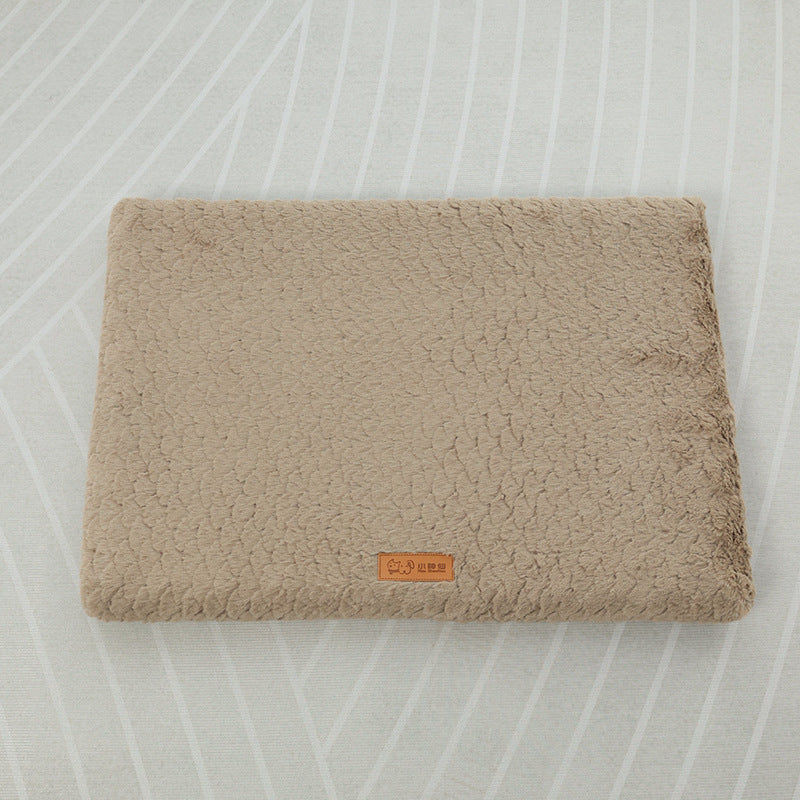 Beige textured blanket on a light gray background