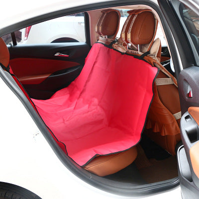 Car seat cover on a brown leather car seat with a red cover