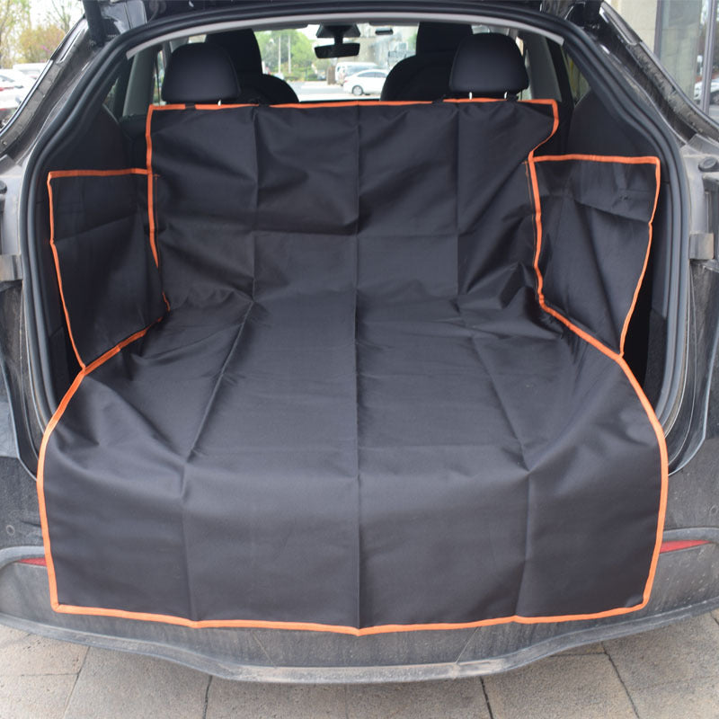 Car trunk with a black pet seat cover with orange trim