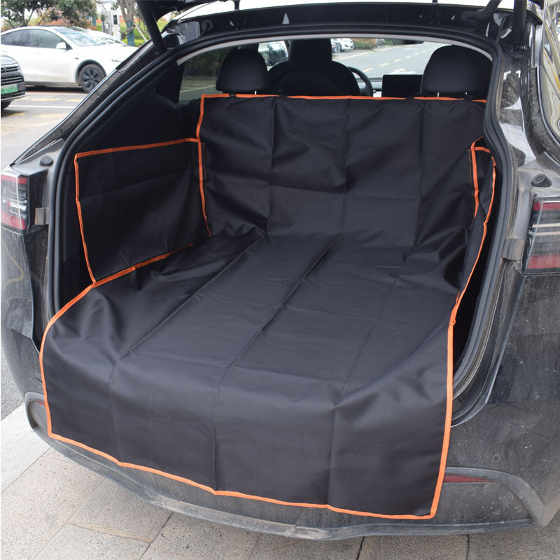 Car trunk with a black and orange pet seat cover