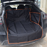 Car trunk with a black pet seat cover with orange trim