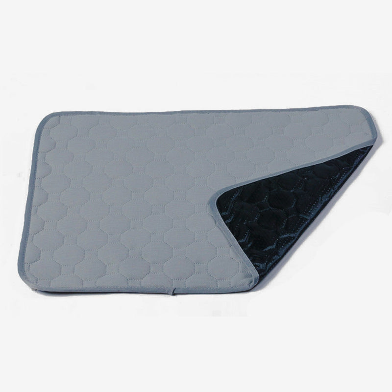 Gray quilted mat with a textured pattern on a white background